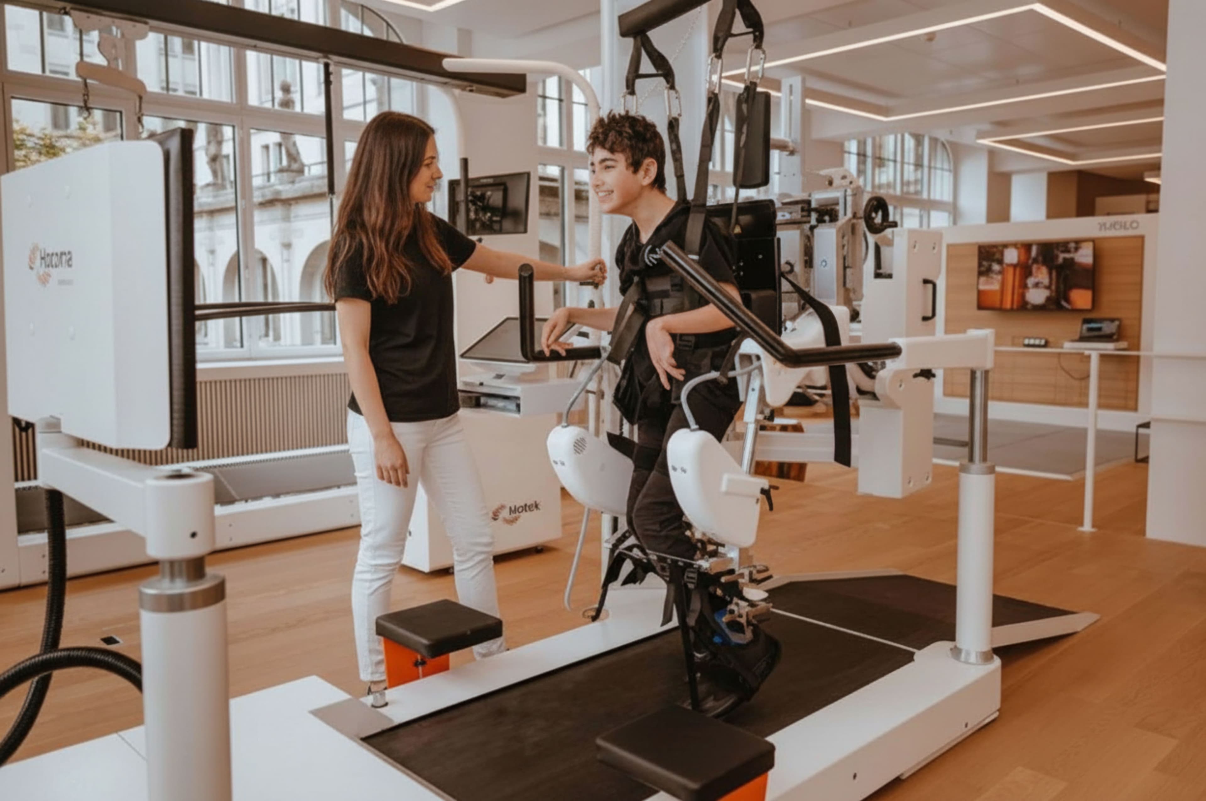 Nataniel in robotic gait training at Nextherapy